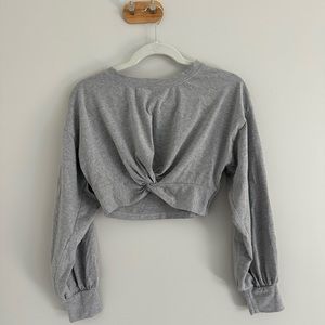 Cropped grey long sleeve top with crossed front